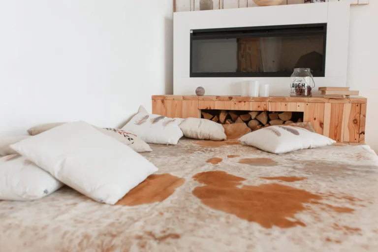 Country house bedroom with natural cowhide wooden bed fireplace